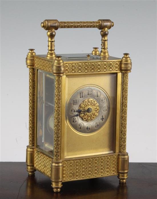 A late 19th century French ormolu hour repeating carriage clock, 7in., with travelling case